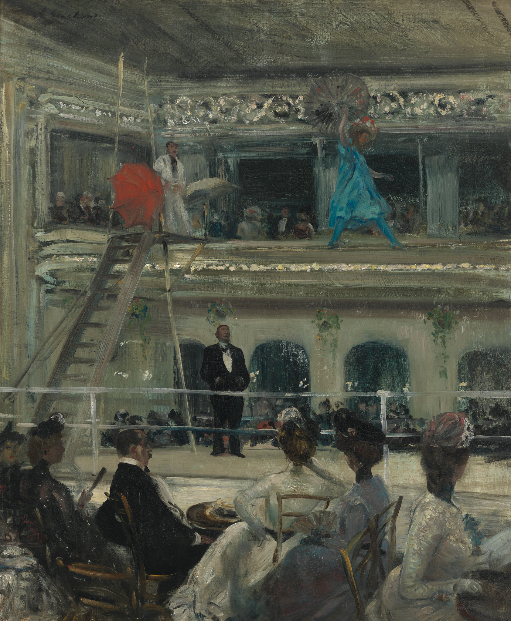 An impressionist painting depicting an indoor scene with elegantly dressed people watching a performance. In the foreground, a group of women in ornate hats and gowns are seated, facing away from the viewer towards a stage. A man in a black suit stands in the middle ground, overseeing the event. On the stage, a woman in a blue dress with a fan dances beside a man on a ladder, while another woman in white with a red parasol stands nearby. The setting suggests a rehearsal or a casual performance in a lavish venue with decorative elements and large mirrors reflecting the audience.