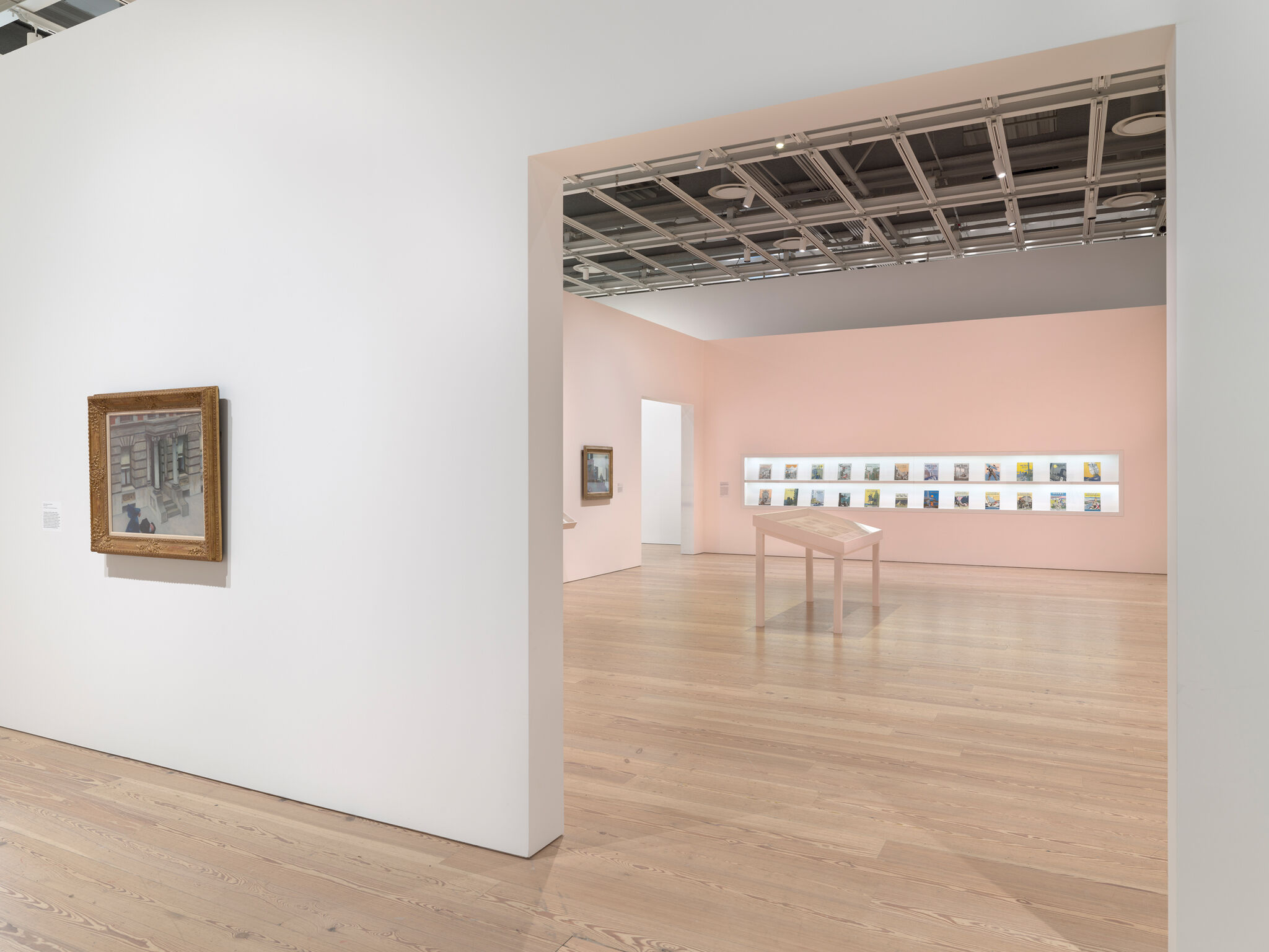 Multiple artwork in a light-filled gallery.